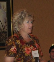 Judy Haigler participates in a team building exercise during the threat centers' joint retreat.