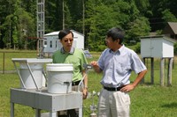 Shirong Liu and Ge Sun at Coweeta Hydrologic Lab
