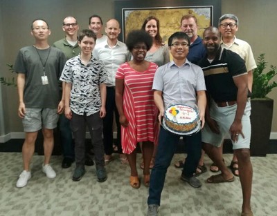 Center staff members say goodbye to Dr. Liu with a special cake.