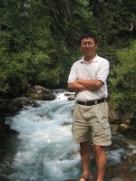 Ge Sun visits the Wolong Giant Panda Reserve in southwestern China during a hydrologic research trip in 2006. The streamwater is derived from a glacier on the Tibetan Plateau.