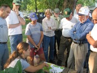 Lindsay Majer, Equinox environmental planner, directs teams for invasive plant removal in Hot Springs, NC.